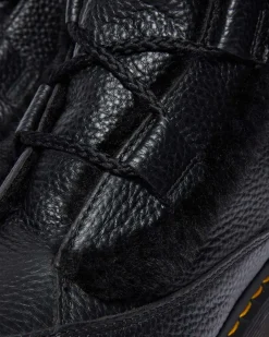 Boots Buzz en cuir Milled Nappa doublées de fourrure synthétique à lacets in Noir